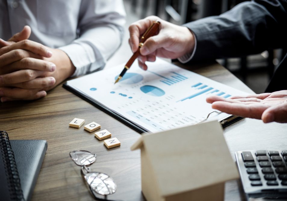 Real estate broker agent being analysis and making the decision a home estate loan to customer to signing contract documents for realty purchase, Bank employees recommend mortgage loan approval.